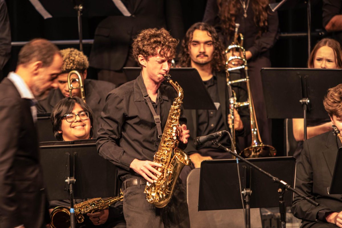 Photo of Senior, Luka Schrock, from the advanced jazz band performing a solo at the PIL Jazz Festival